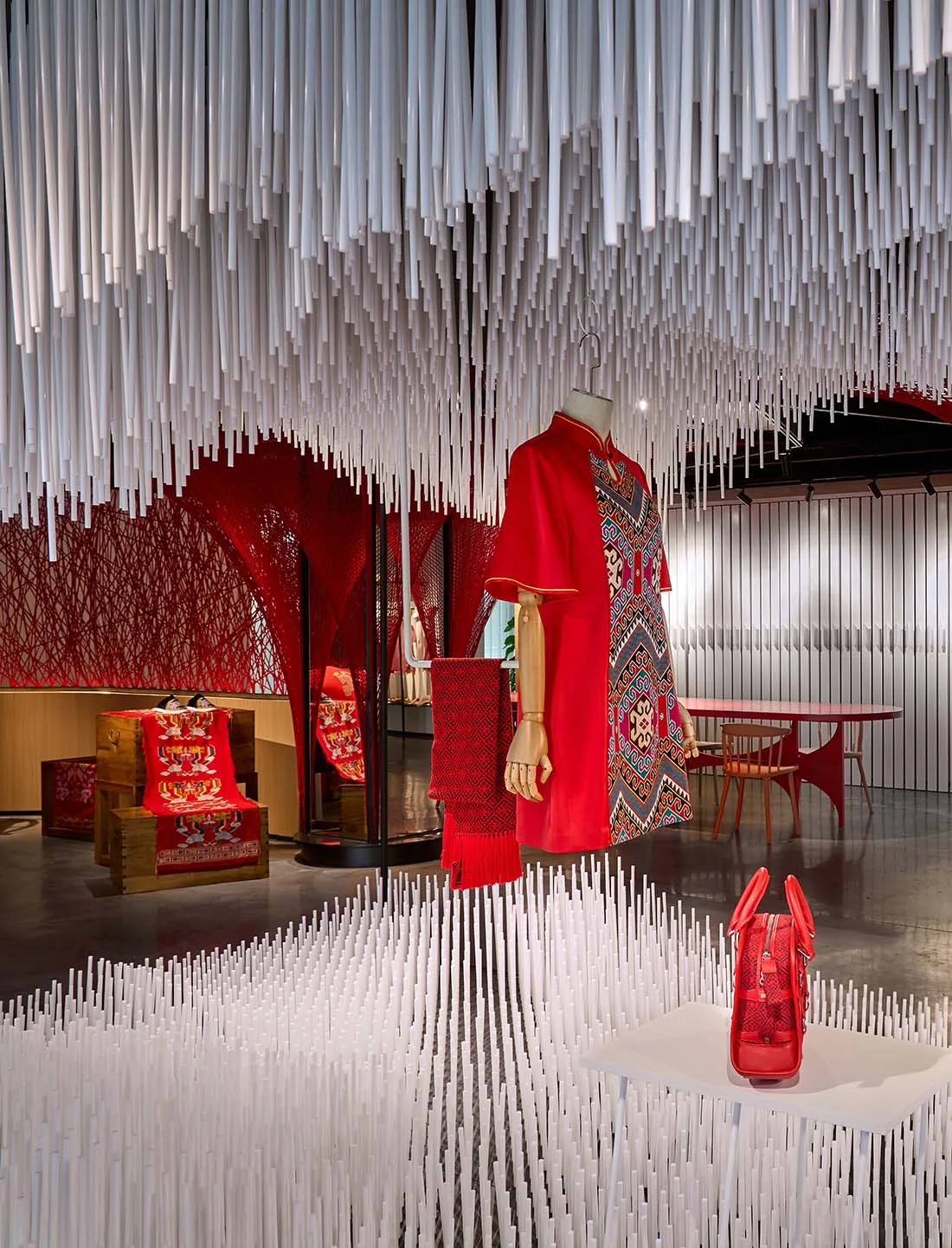 Retail store with red and white textiles on display.