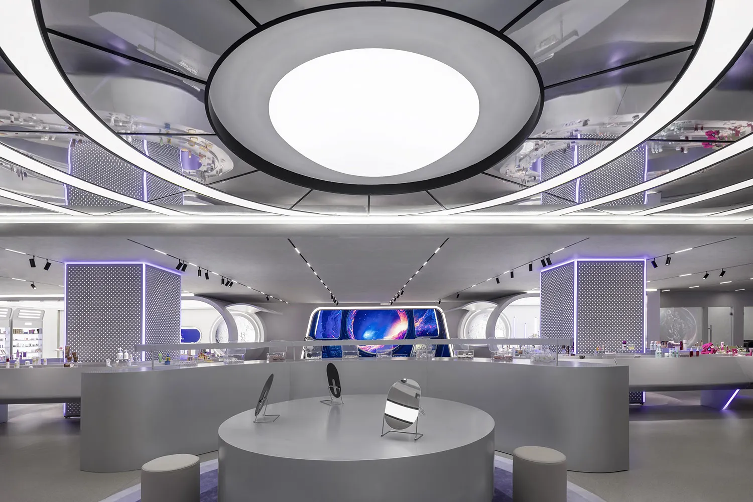 A modern retail store interior featuring metallic sheets and circular lighting fixtures.