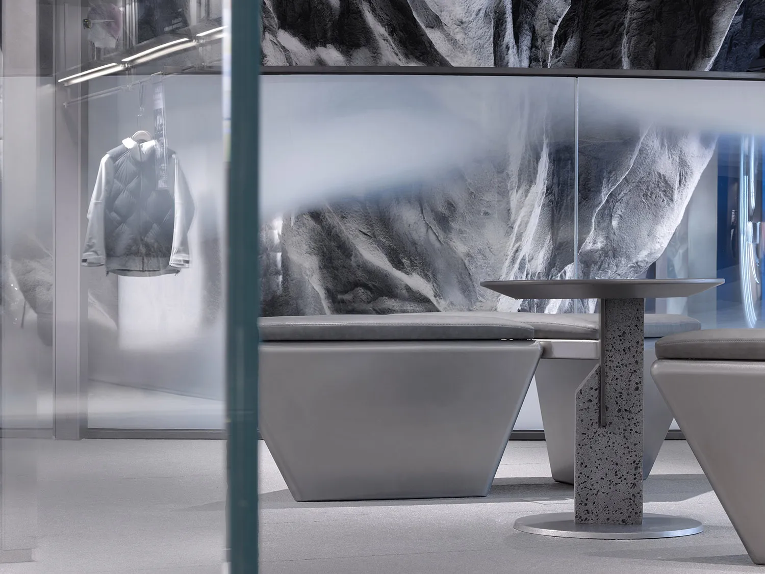 A modern commercial interior space featuring concrete elements and a minimalist design.