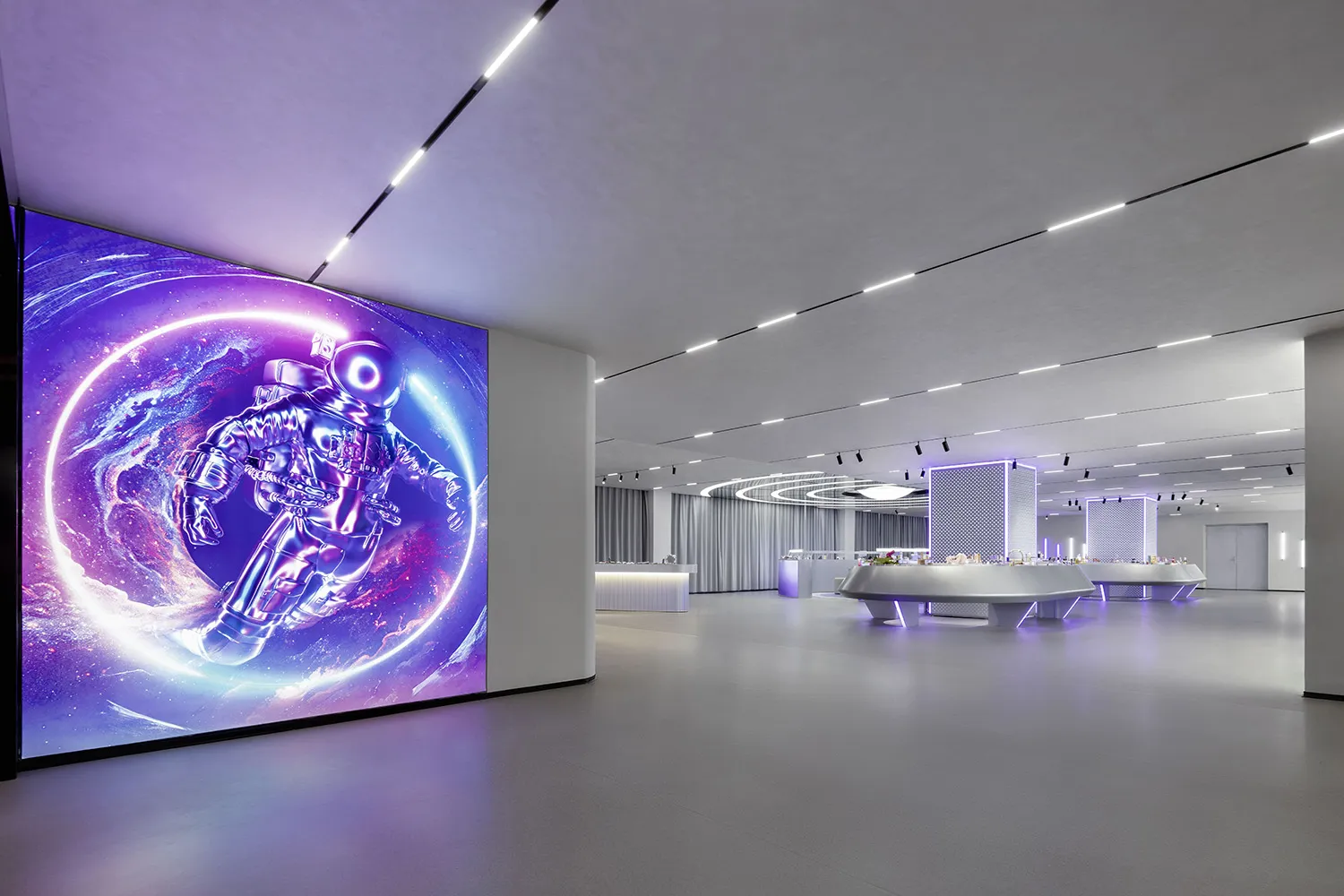An expansive, futuristic-looking corporate event space featuring an LED wall display of an astronaut in space