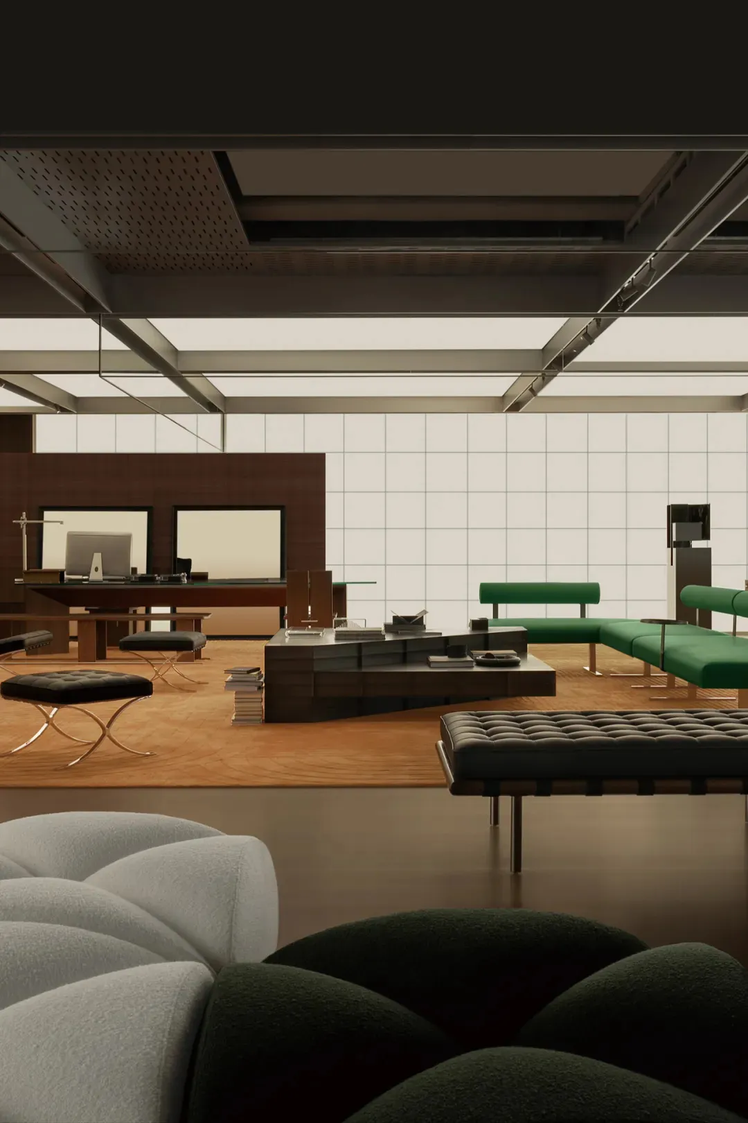 A modern office space with wooden flooring and green upholstered furniture.