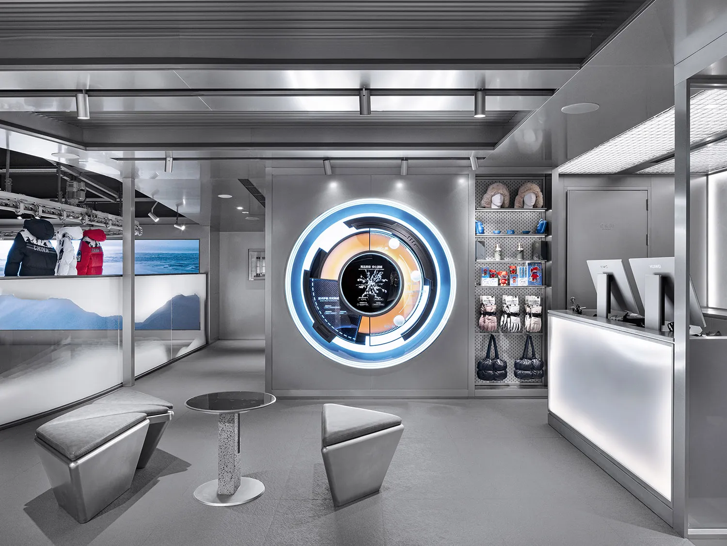 Modern retail store interior featuring metallic structures and illuminated merchandise displays.