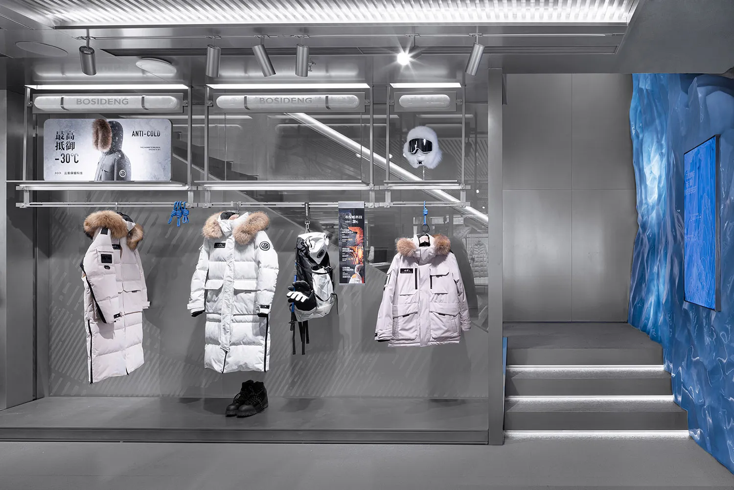 Modern retail shop interior with glass walls and metallic accents.