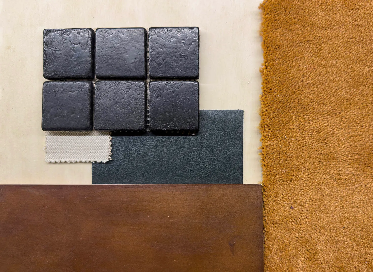 Various material samples including tiles, leather, fabric, and wood.