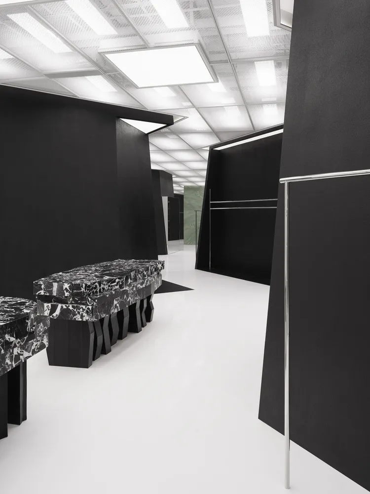 A minimalist retail storefront featuring black marble accents.