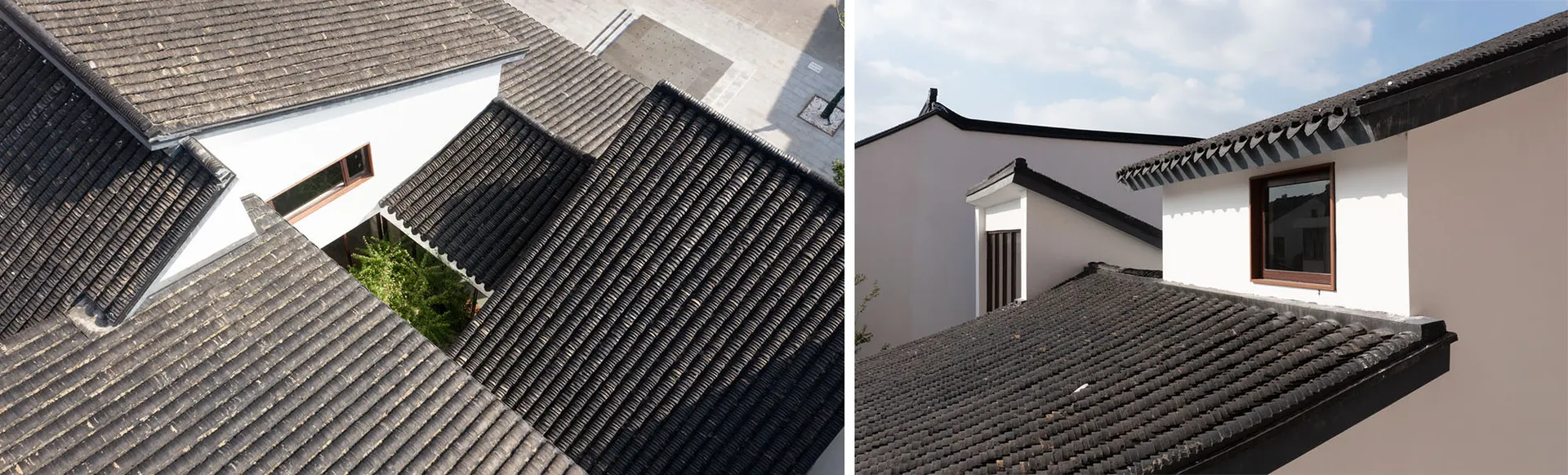 A view of a building's roof with black terracotta tiles.