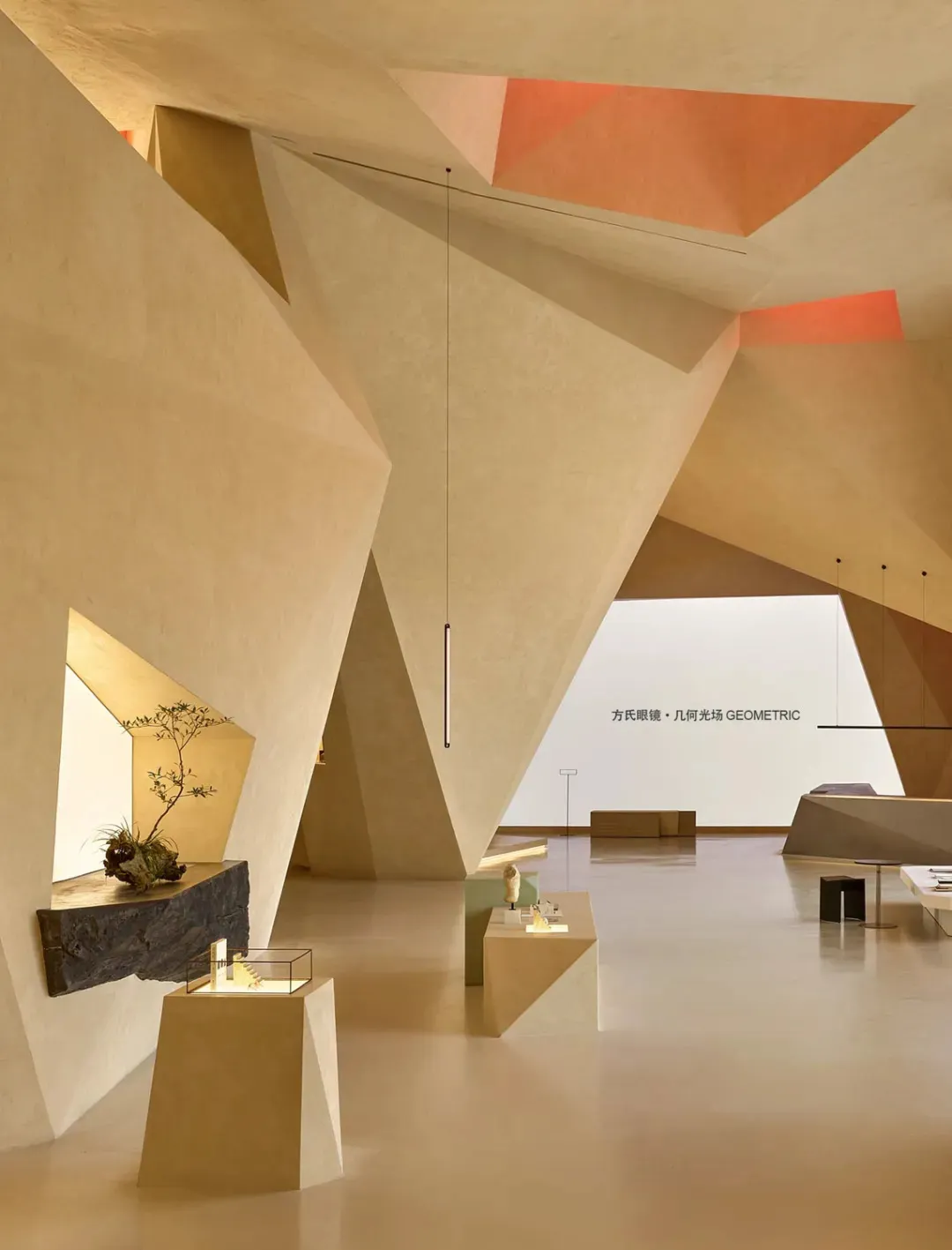 A spacious showroom featuring modern architectural design elements in a concrete setting.