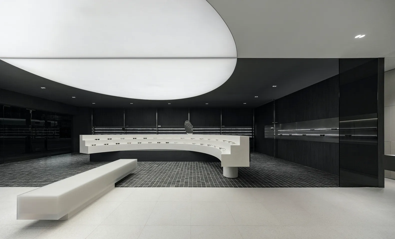 A modern retail store with concrete, glass, and metal finishes.