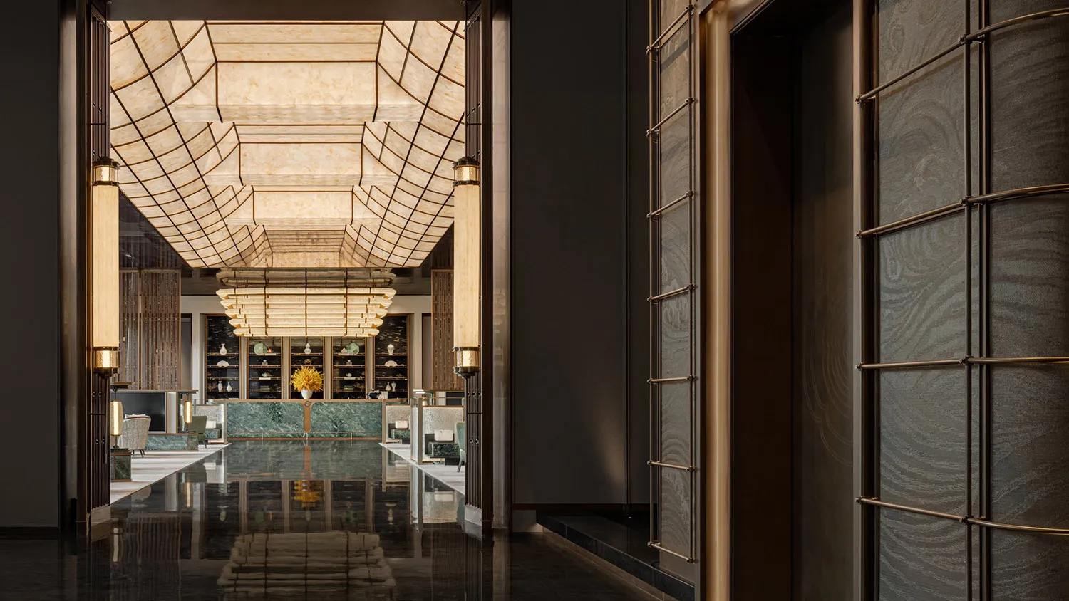 A modern hotel lobby featuring marble, glass, and metal elements.