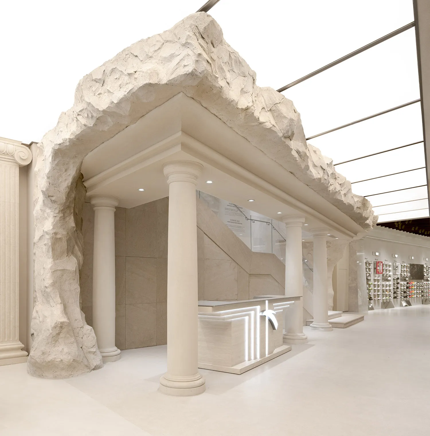 Industrial commercial interior with concrete materials and unique design elements.