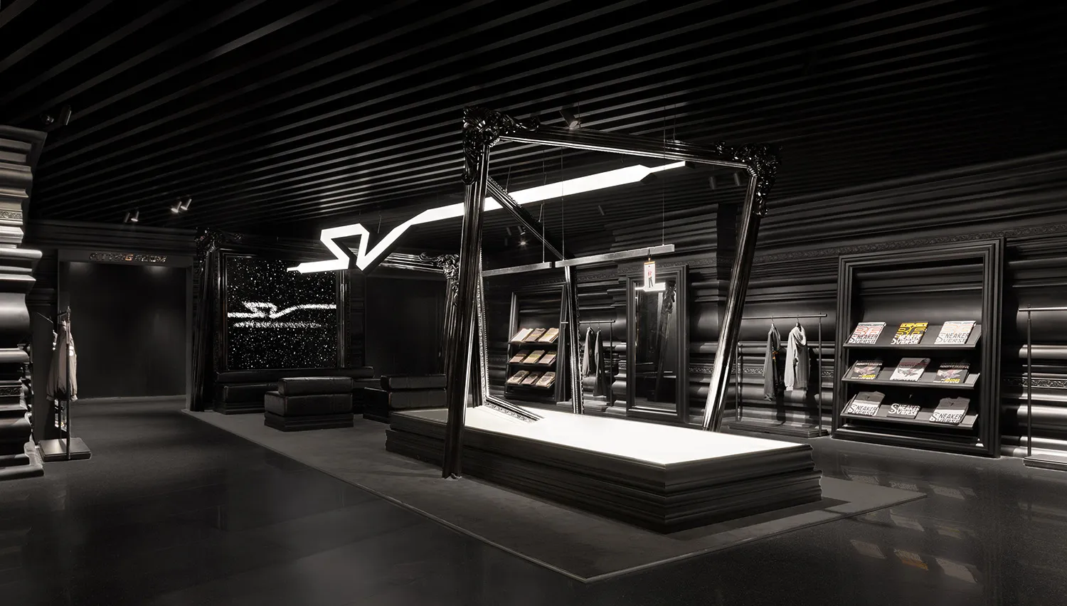 A minimalist retail space with a black metallic interior design and abstract lighting installation.