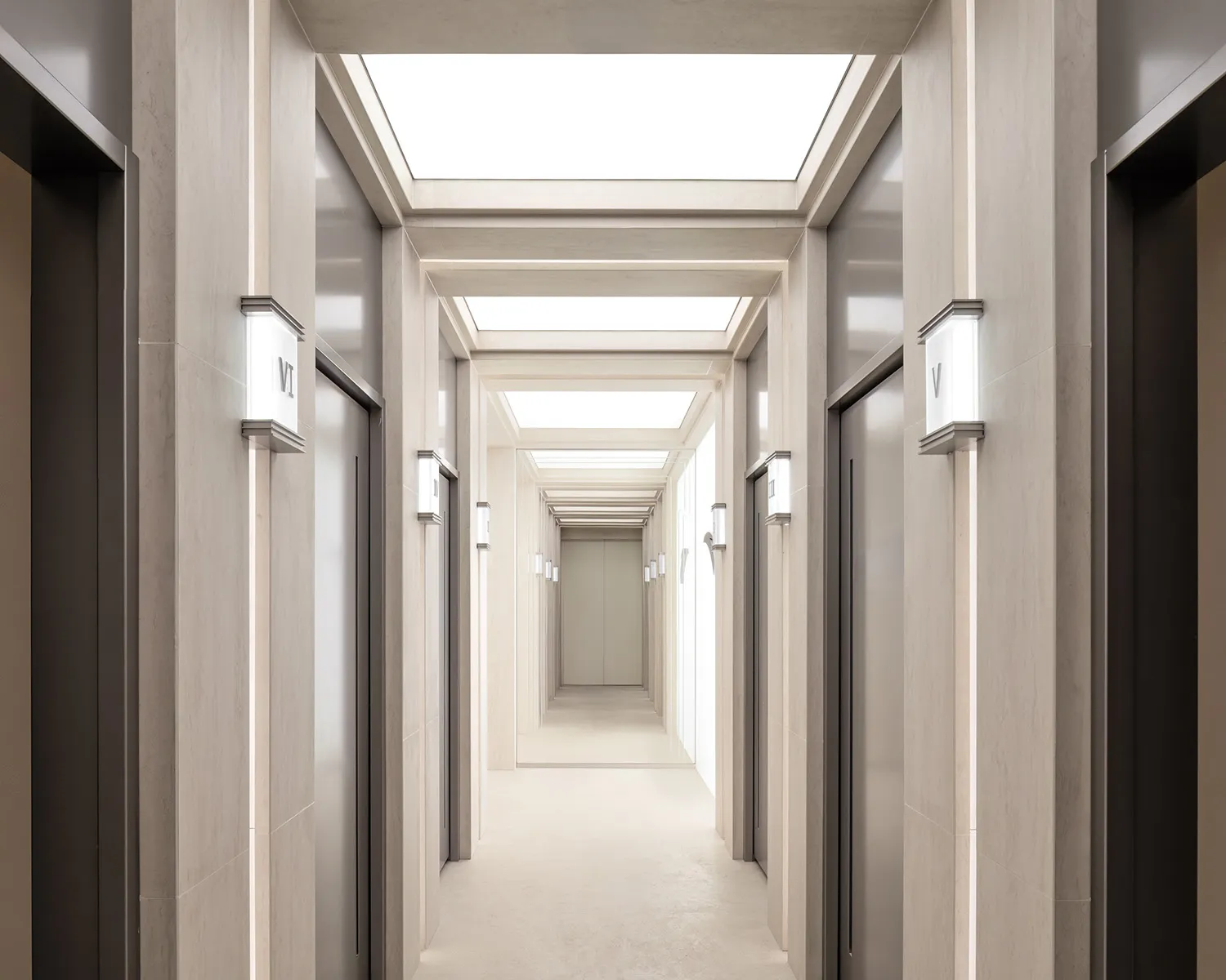 Modern, minimalist corridor with concrete walls and stairs
