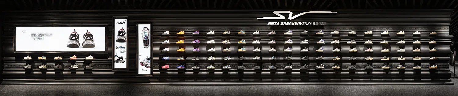 A modern retail display featuring a collection of shoes on shelves.