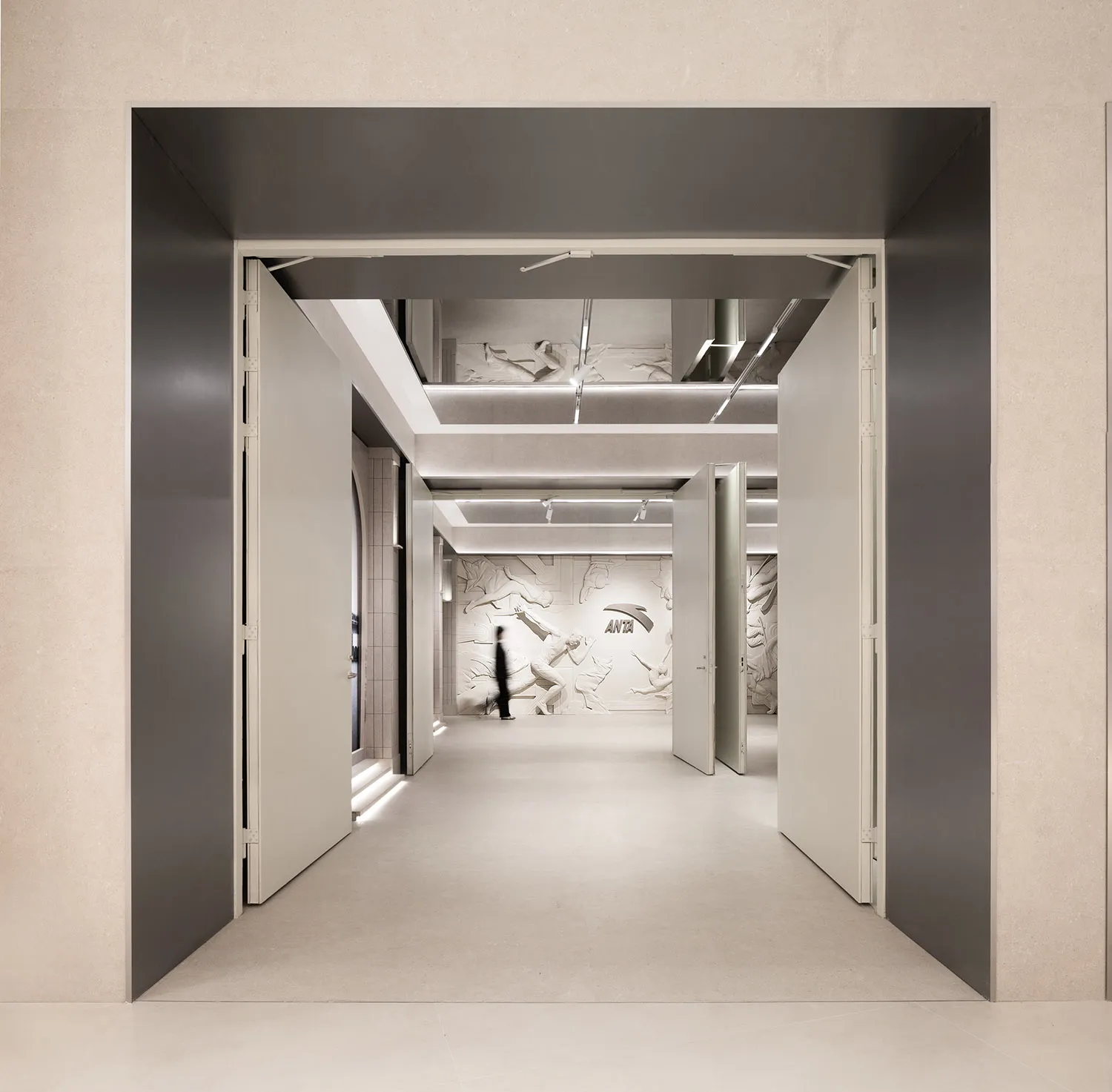 An image of a minimalist office interior with concrete and metal materials.