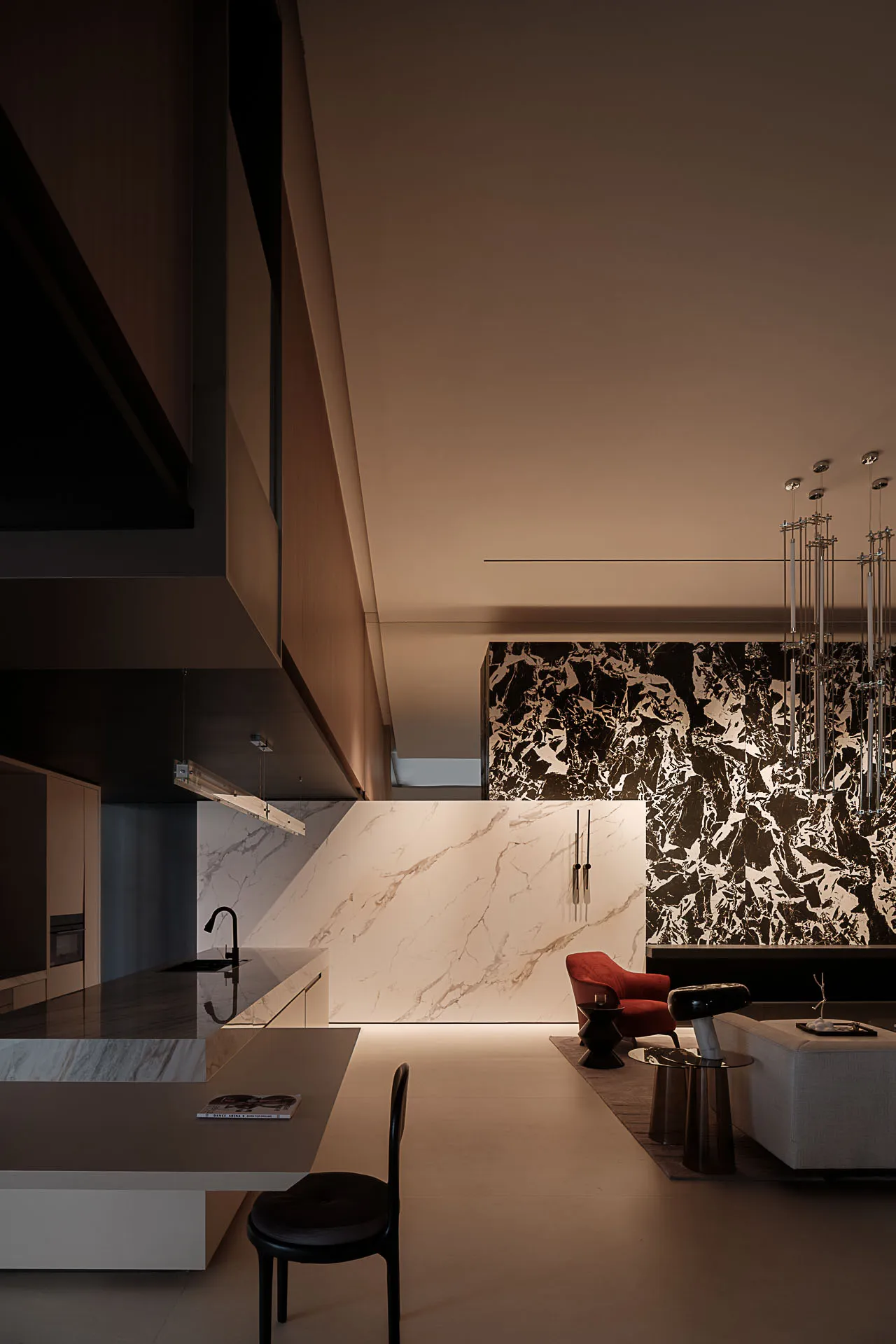 Modern kitchen featuring a marble backsplash and countertop.
