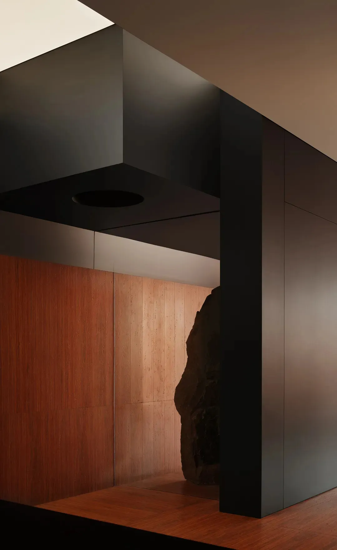 Modern interior design featuring black walls and wooden materials