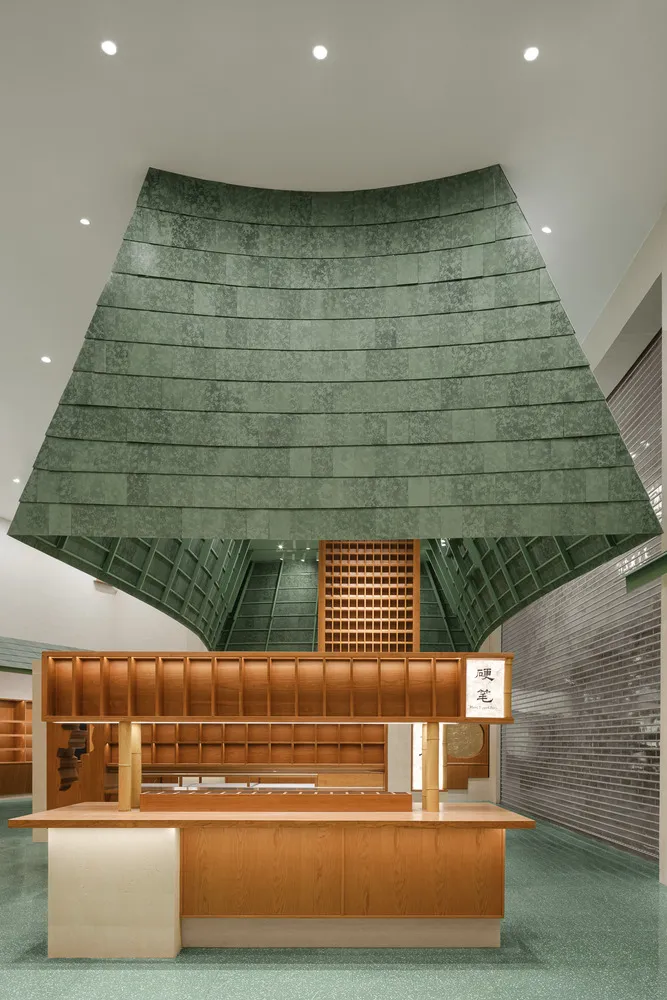 Industrial commercial interior with steel elements, green accents, and functional design.