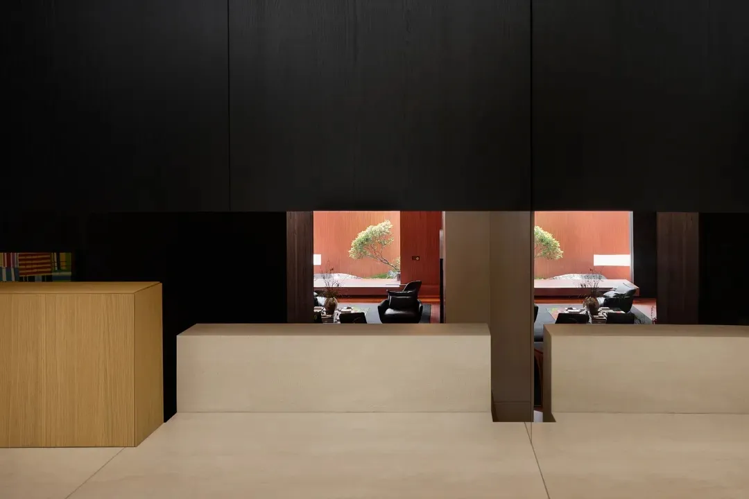 Modern restaurant interior with wooden columns and seating arrangements.