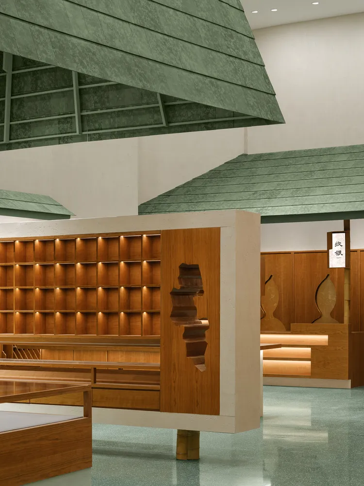 Modern retail space with wooden shelves and green roof structure.