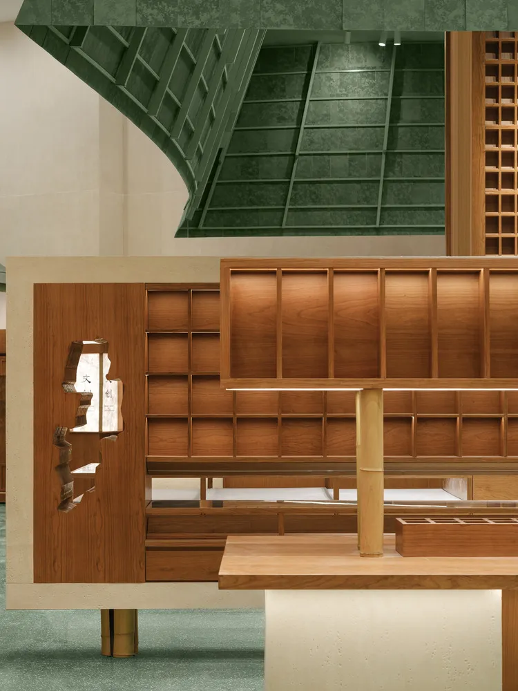 A modern retail shop interior with wooden displays and green architectural elements.