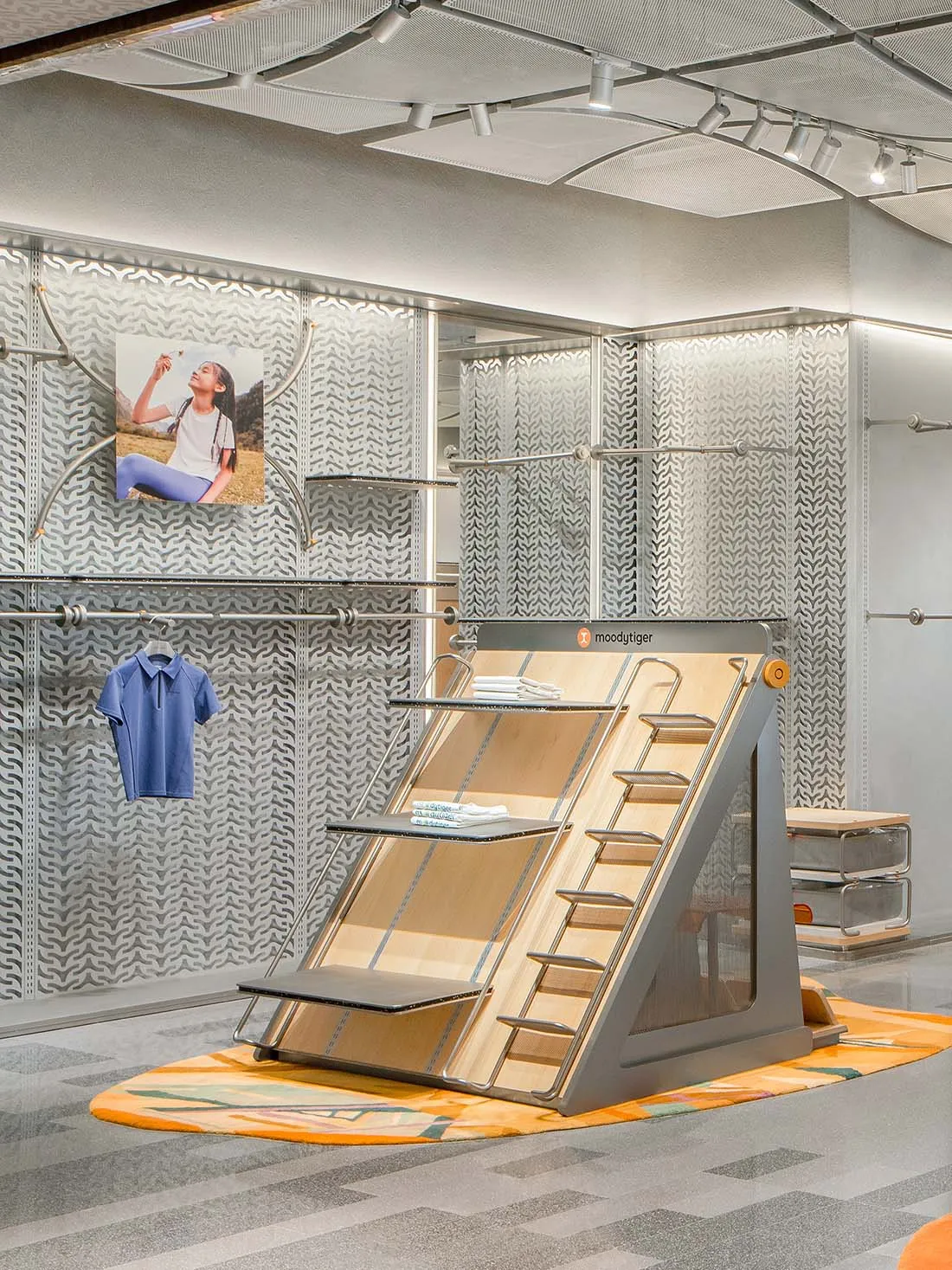 Modern, minimalist store interior featuring a metal rack system.