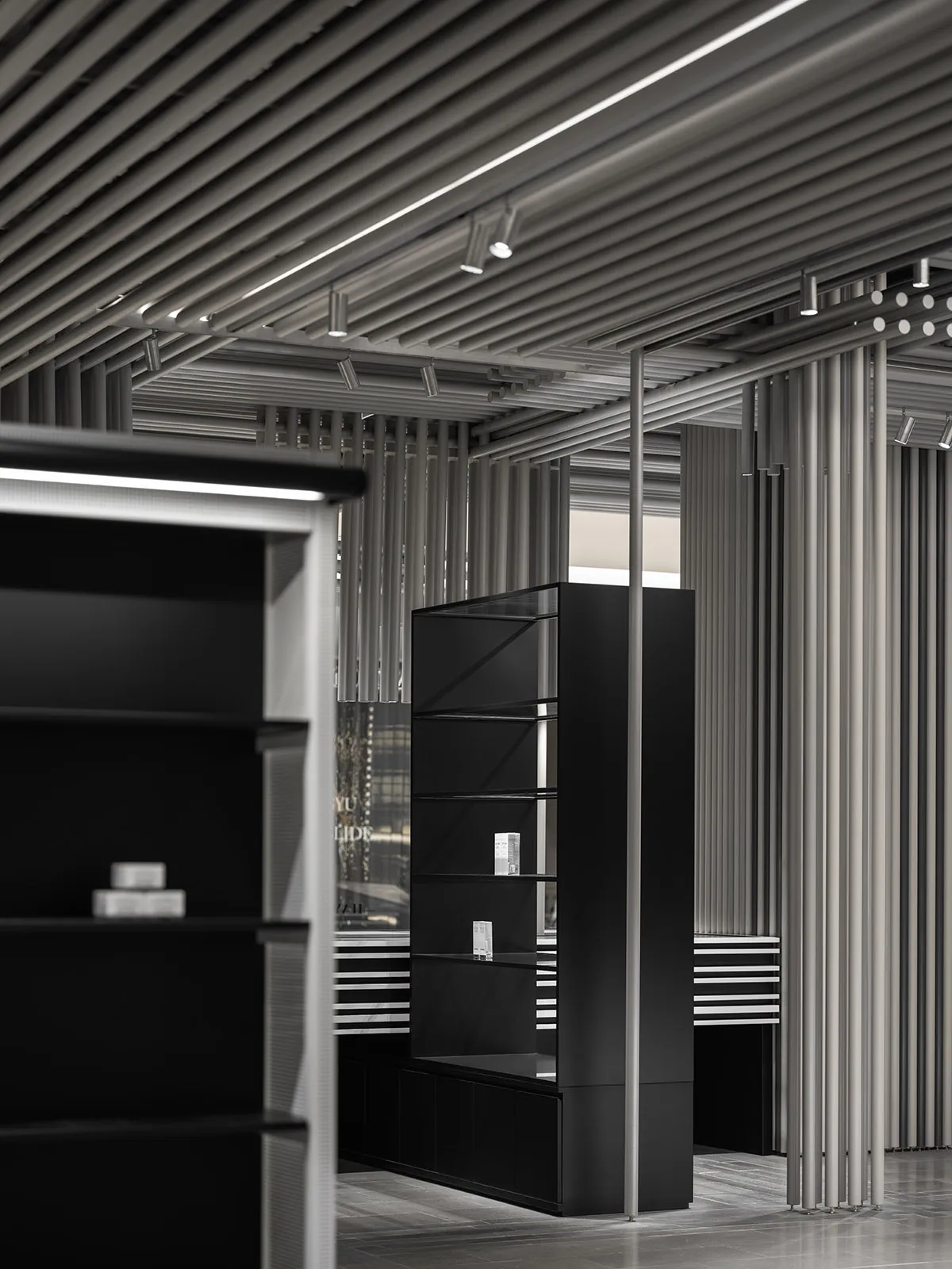 A modern retail storefront with black shelves.