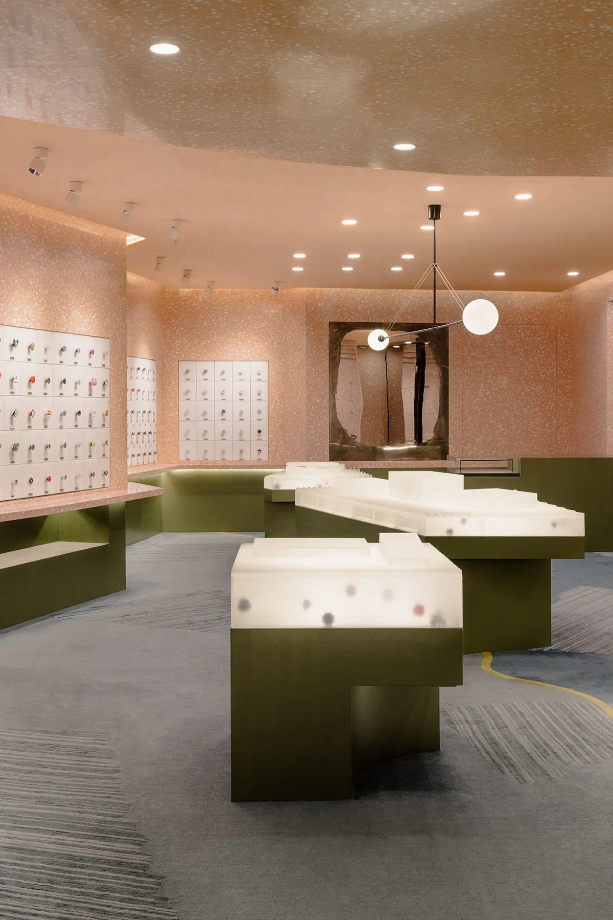 A minimalist retail store featuring a modern design with terrazzo flooring.