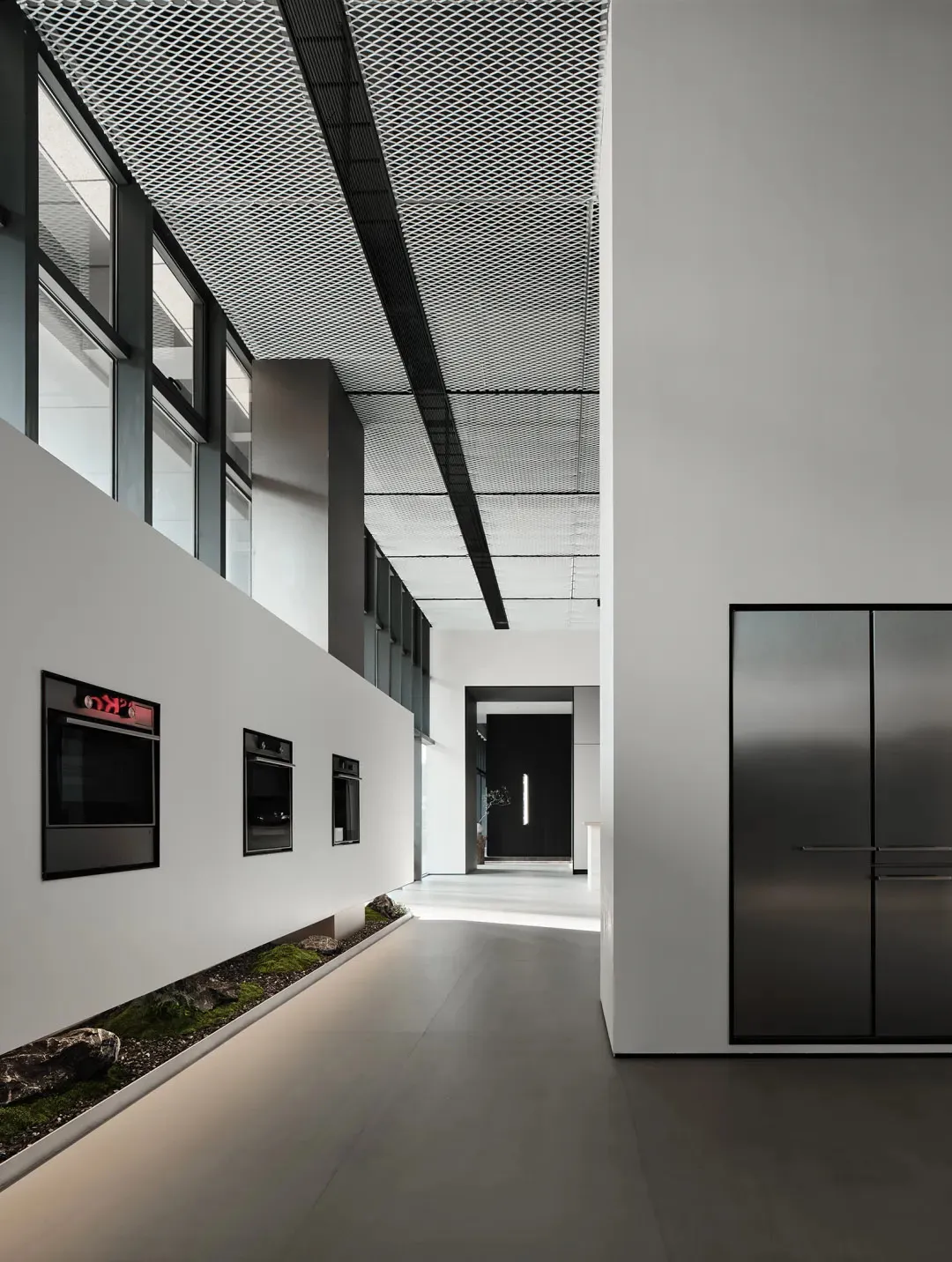 Modern residential interior with industrial design elements, featuring metal materials and a minimalist aesthetic.