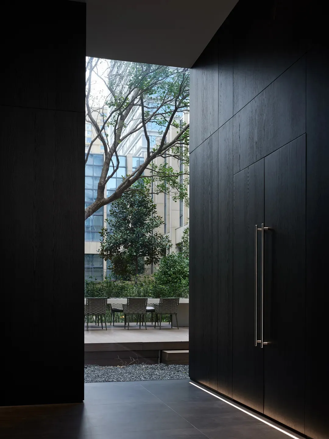 Modern residential interior featuring wooden panels and lighting