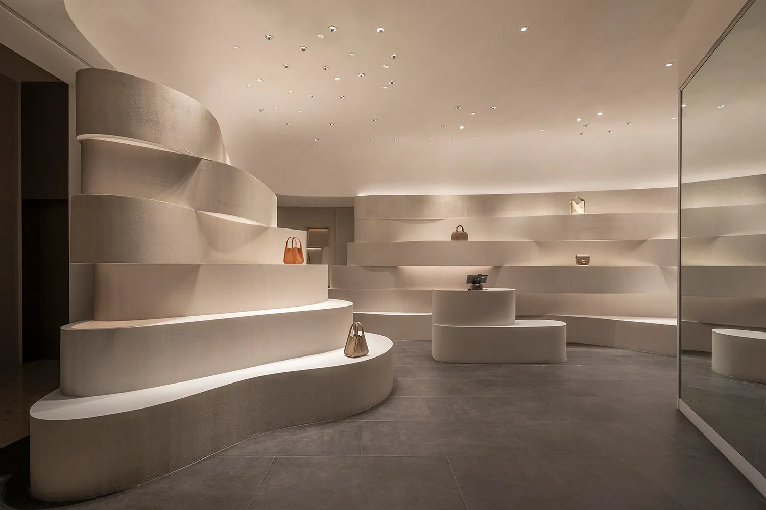 Modern retail store interior featuring minimalist design with concrete elements