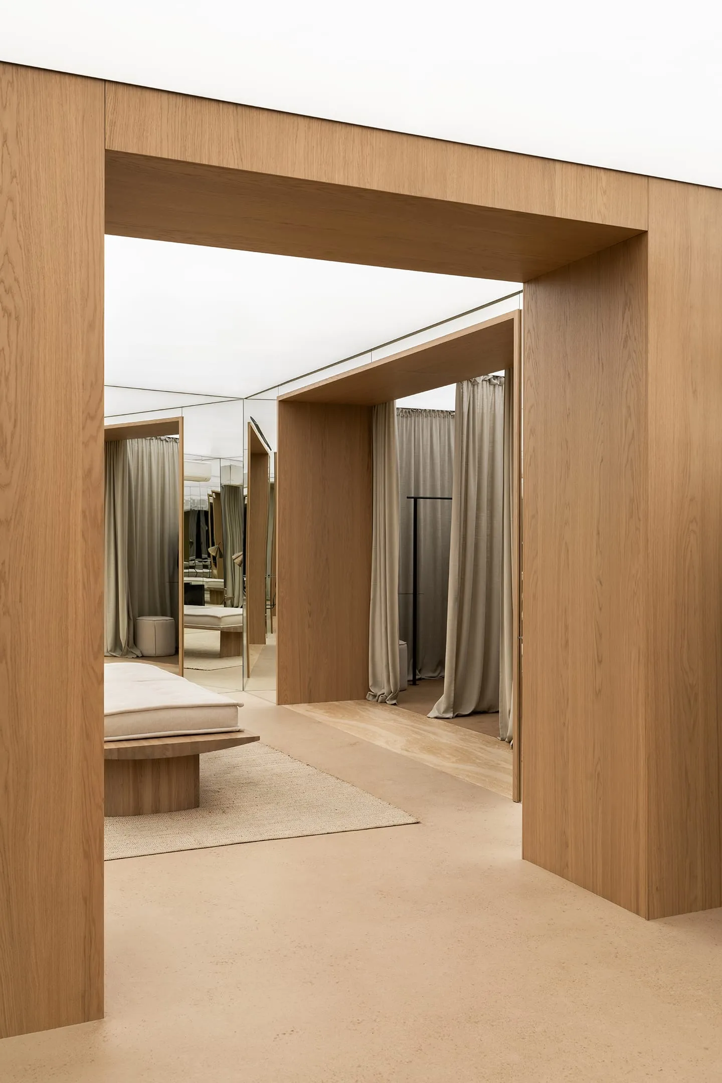 A modern interior design room featuring wooden furniture and flooring.