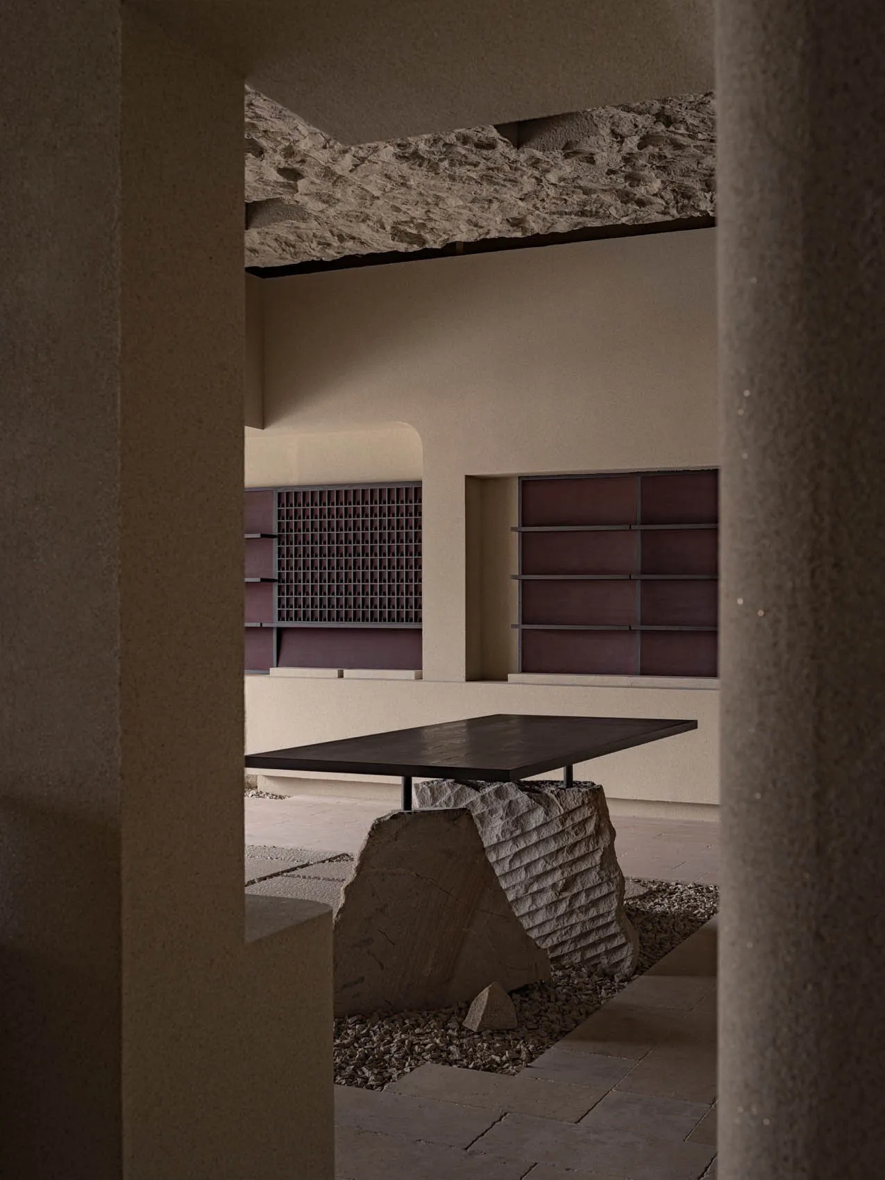 A minimalist interior design featuring stone and wood elements.