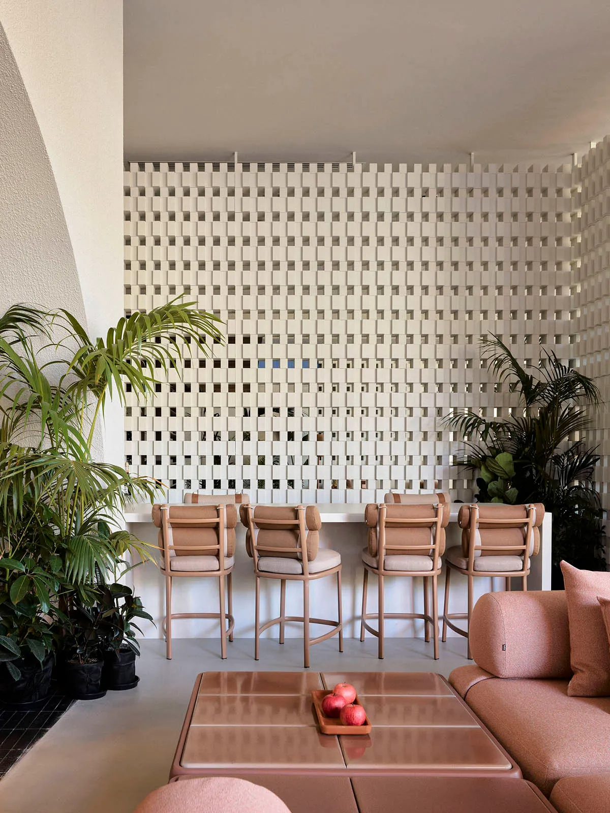 Interior of a modern coffee shop featuring concrete, glass, and wood materials.