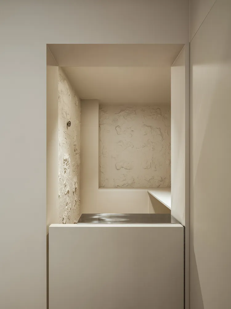 Minimalist bathroom with a concrete and metal interior