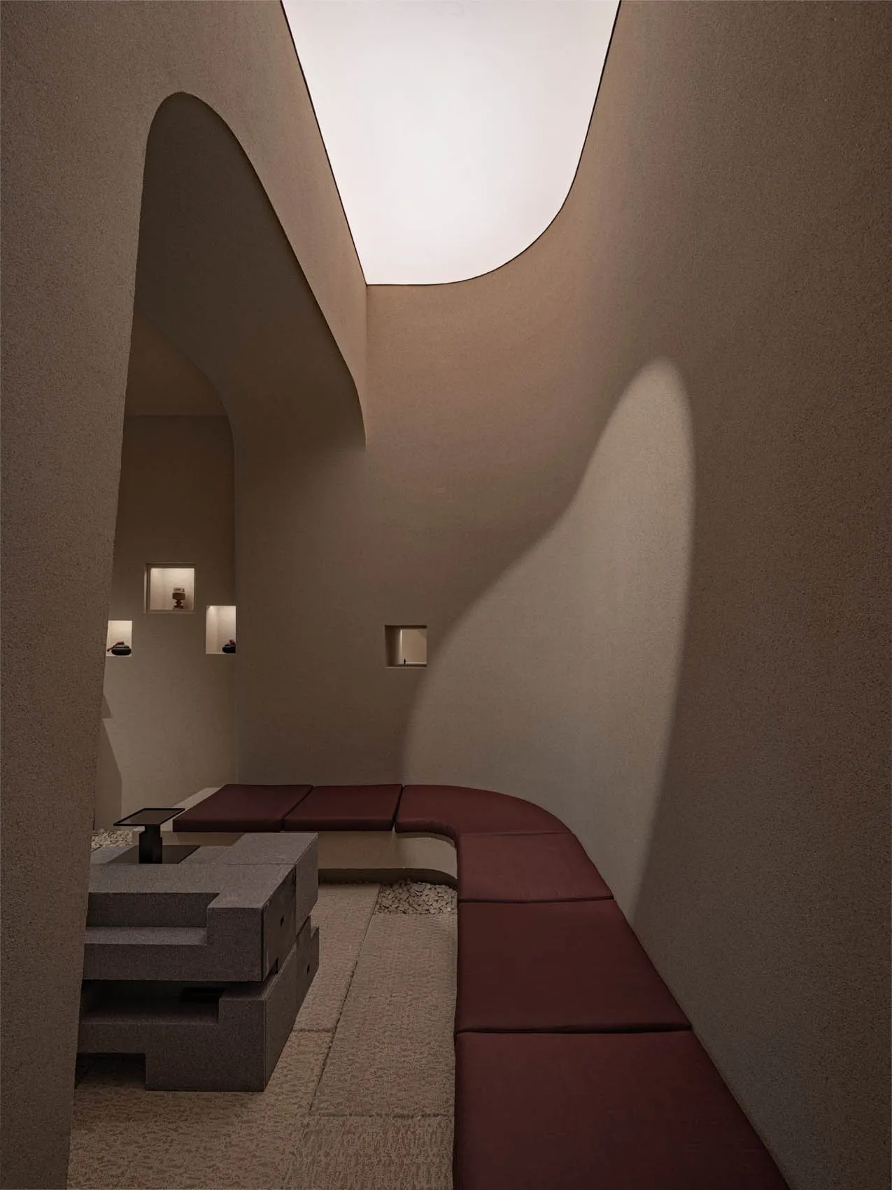 Modern interior design featuring concrete materials and minimalist furniture.