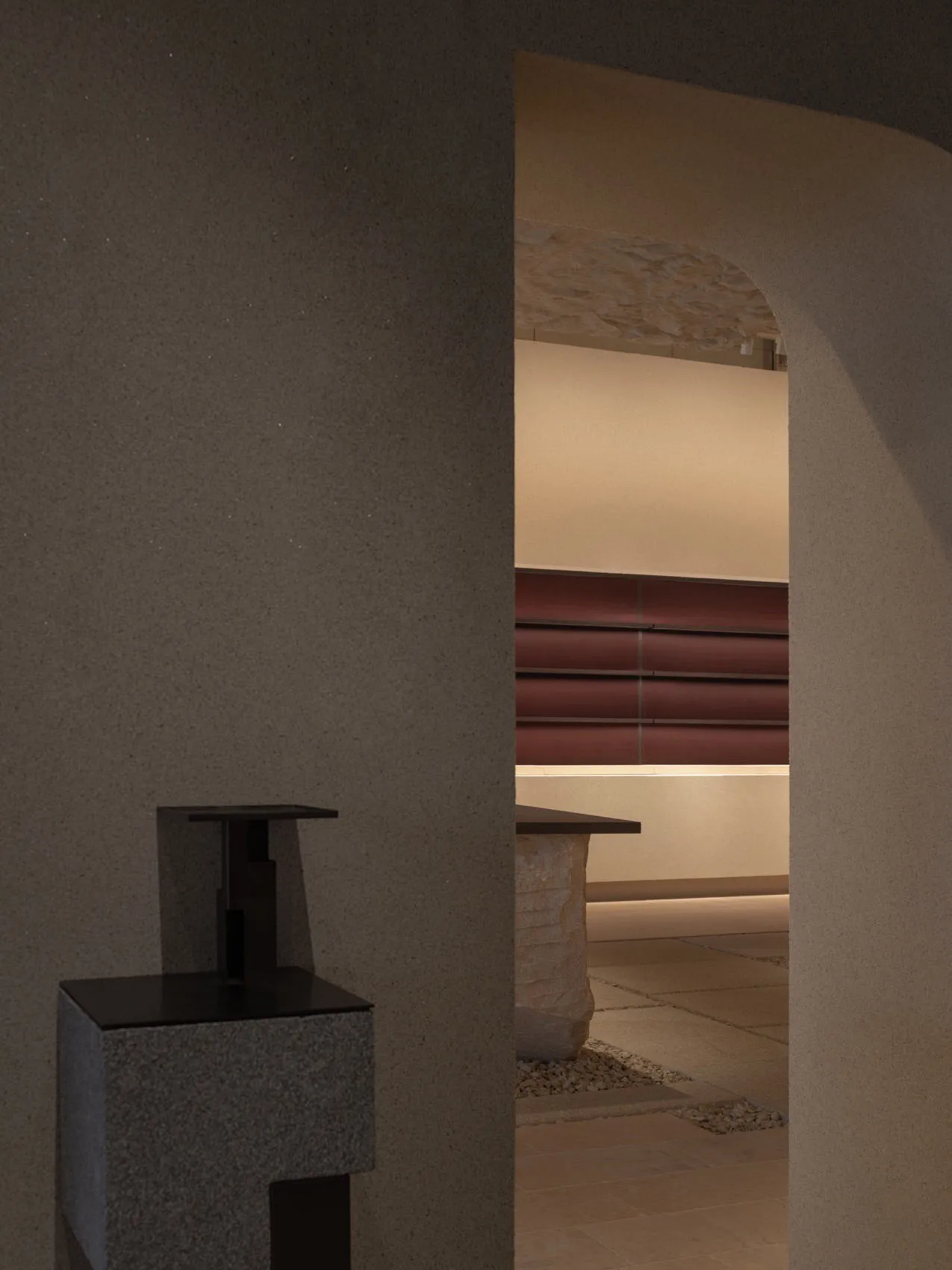 A minimalist, modern interior space featuring concrete materials.