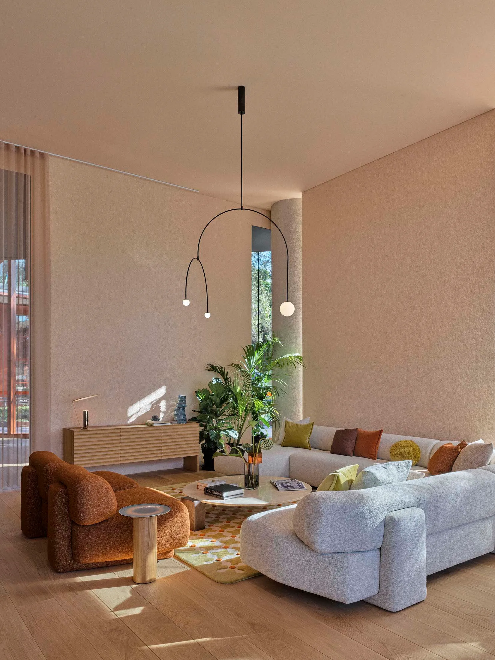 A modern living room with neutral-colored fabrics and minimalist design features.