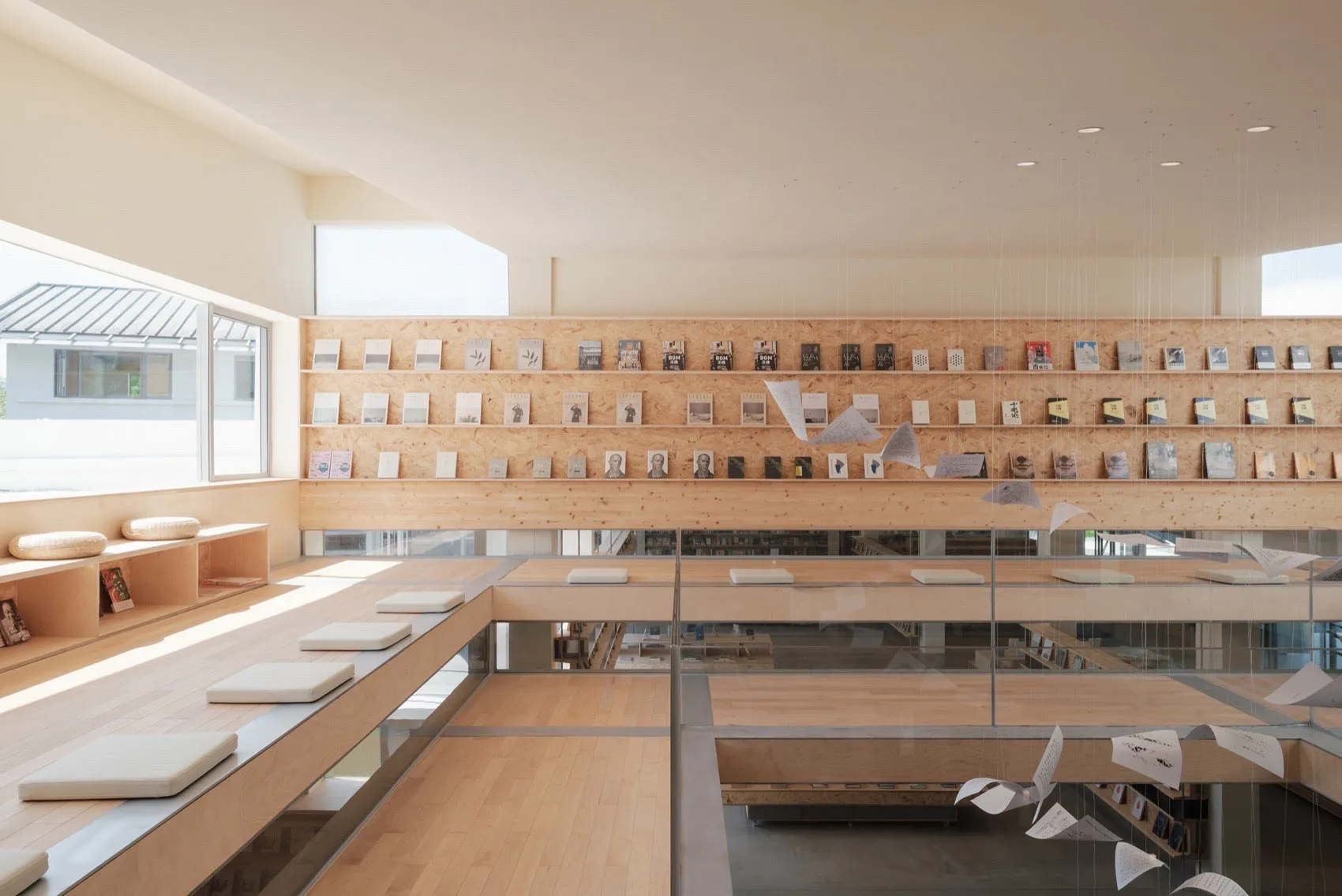 A modern bookstore interior with wooden shelves displaying books.