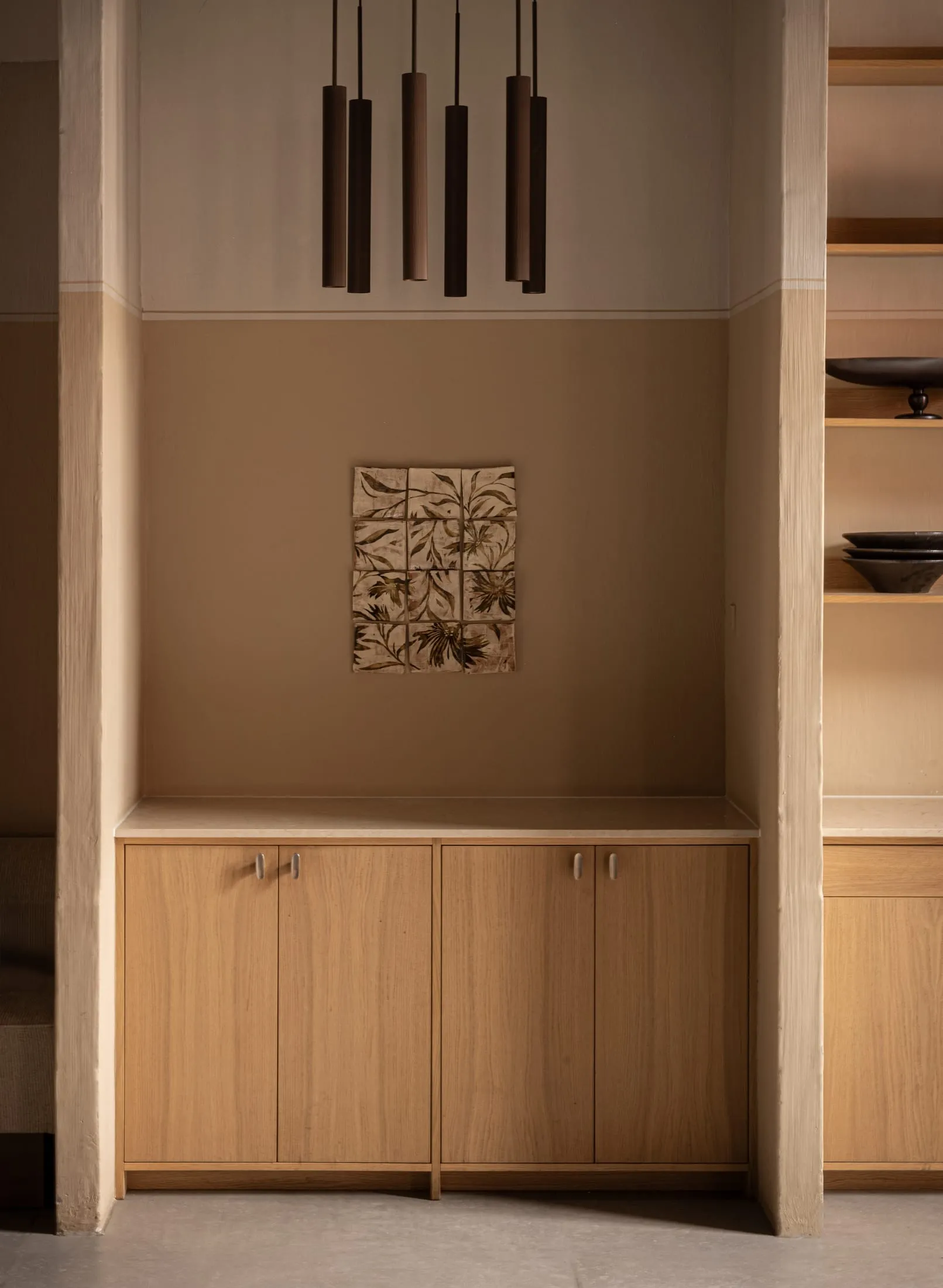 Modern minimalist wooden kitchen cabinets with a sleek design.