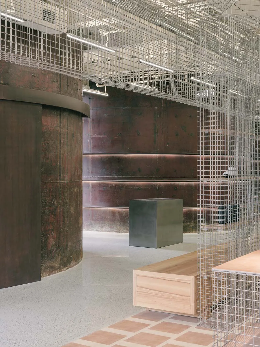 Modern office space featuring metal, wood, and concrete materials