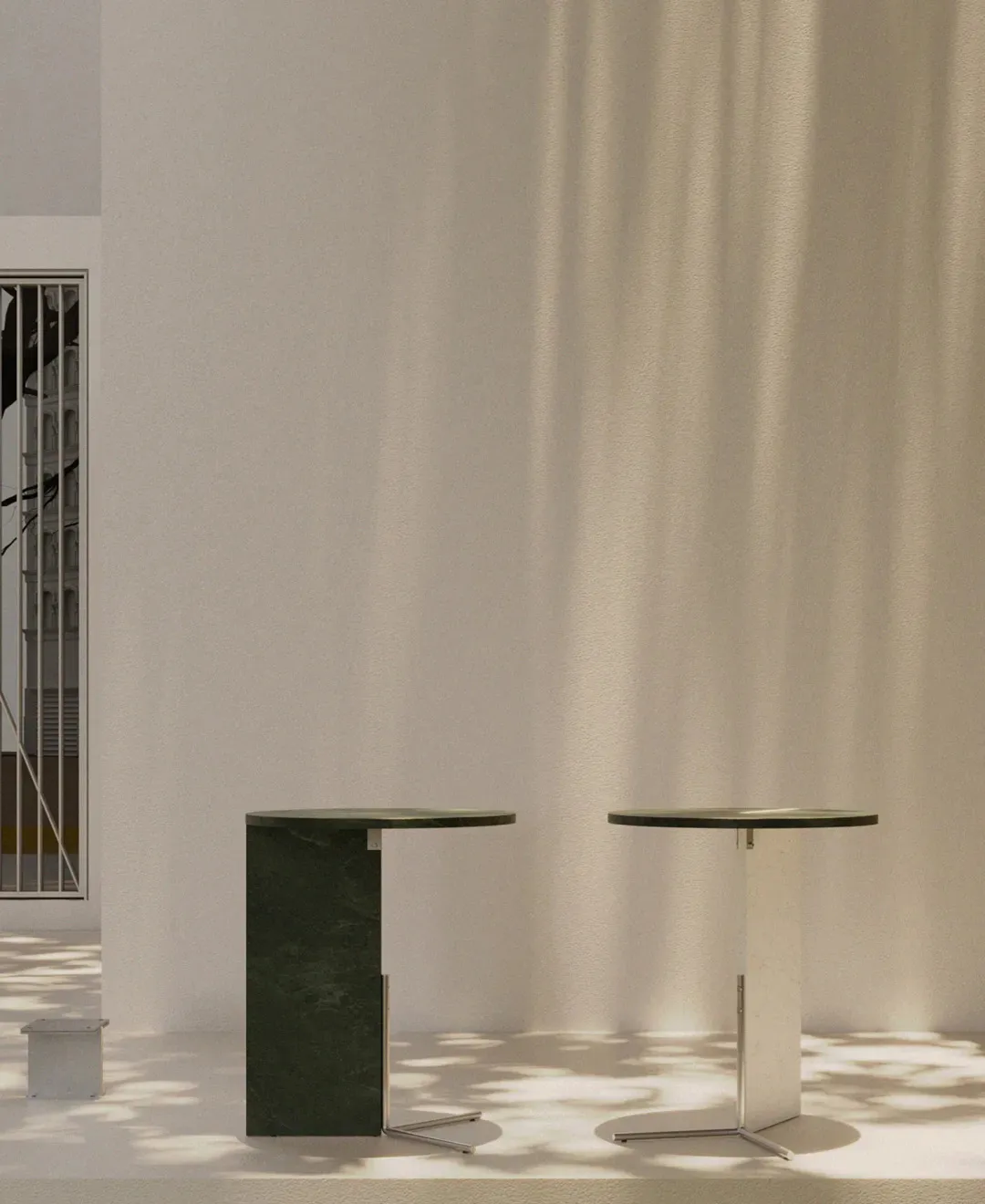 Modern marble coffee tables in minimalist room setting with natural lighting.
