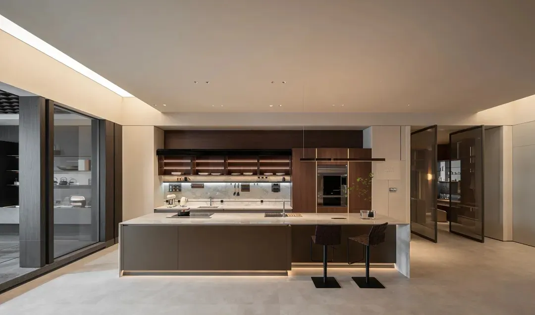 Modern kitchen featuring wooden cabinets and marble countertops