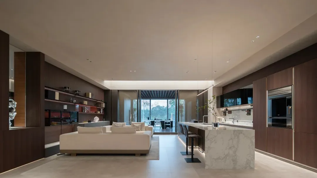 Modern residential interior featuring marble countertops and concrete flooring.