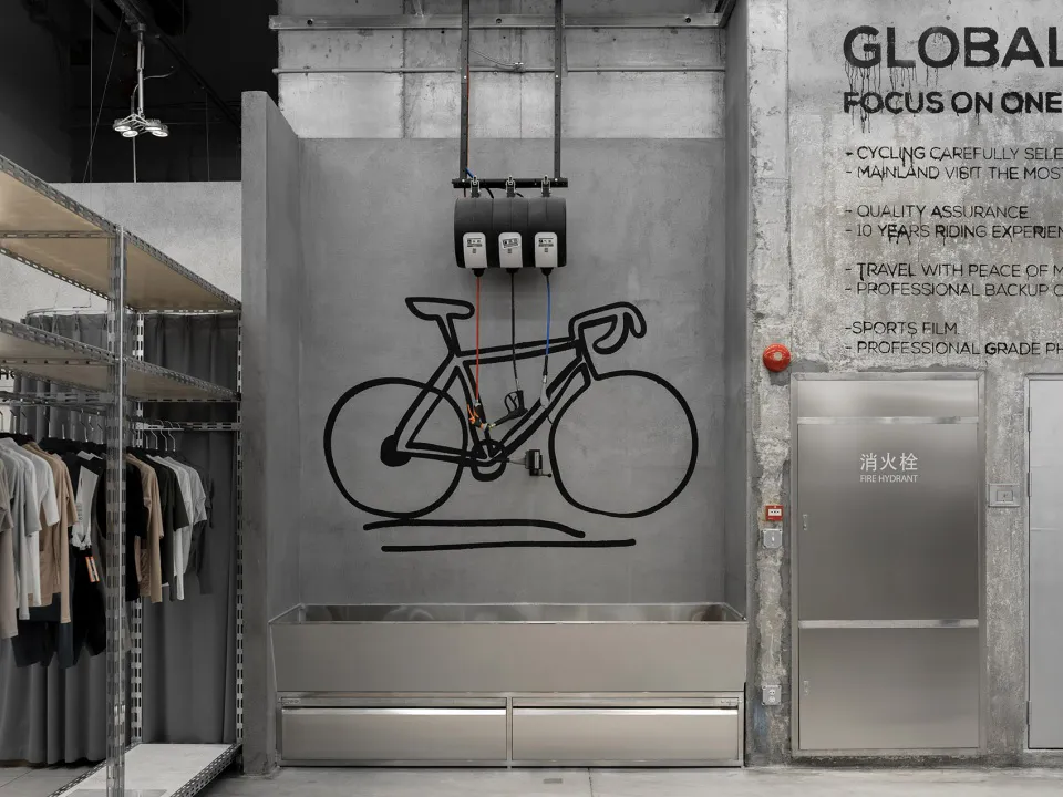 An industrial-style retail store with concrete walls and minimalist design.