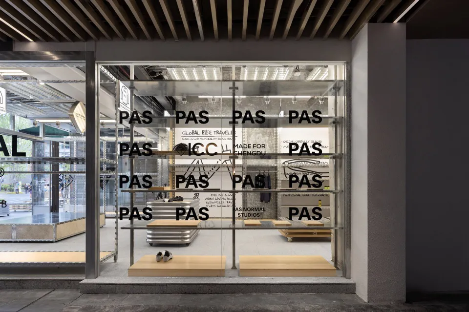 Modern retail storefront with transparent glass panels and minimalist design elements.