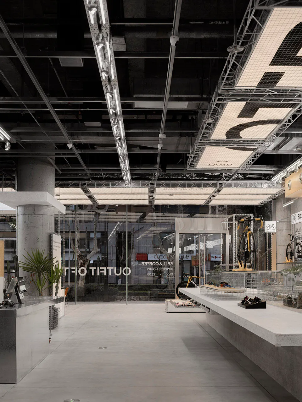 Modern retail space featuring concrete, metal, and glass materials