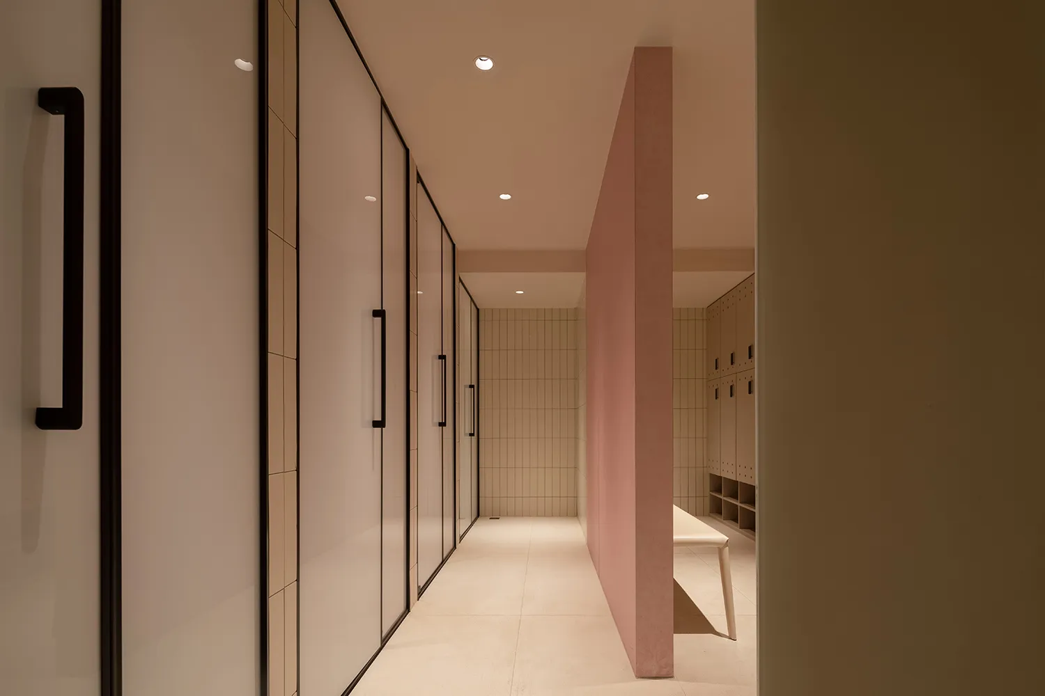 Modern minimalist interior with glass and concrete walls, providing a sleek and contemporary aesthetic.