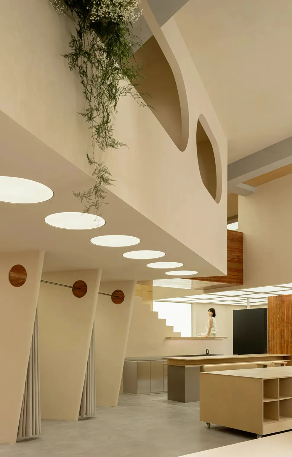 A minimalist retail storefront with wood and concrete finishes.