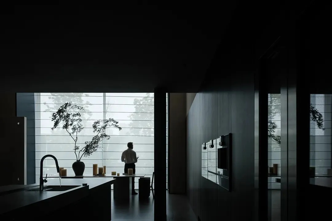 Minimalist modern kitchen with glass and stainless steel