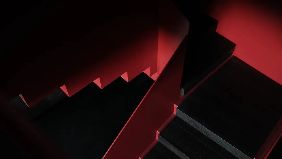 Black wooden staircase with red accents
